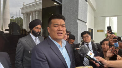 Court allows two Sabah assemblymen accused of taking bribes from businessman Albert Tei to retrieve passports pending trial