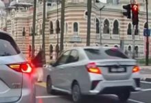 Pemandu e-hailing ditahan langgar lampu merah, nyaris langgar pejalan kaki dalam video tular