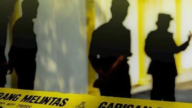 Cop killed as trailer skids and collides with car