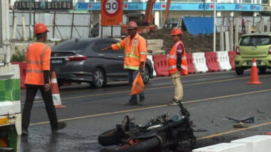 Dragged 40 metres under lorry in Sarawak: Woman killed, two hurt in motorcycle-car crash near Unimas