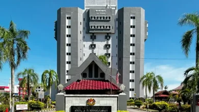 Woman charged with misusing company funds to pay husband