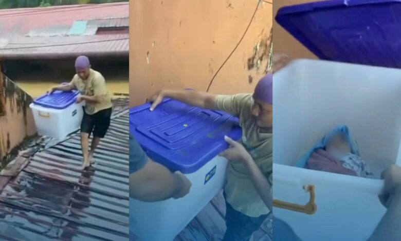Penduduk letak bayi dalam kotak semasa banjir