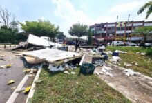 Lorry carrying fruits and vegetables overturns in Shah Alam, driver trapped