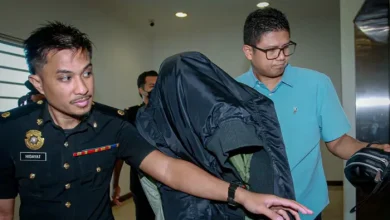 Customs assistant director charged with receiving bribes to close case