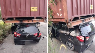Driver killed after car rams into stationary truck