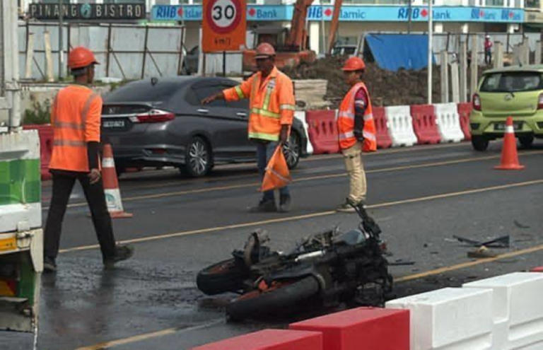 Dragged 40 metres under lorry in Sarawak: Woman killed, two hurt in motorcycle-car crash near Unimas
