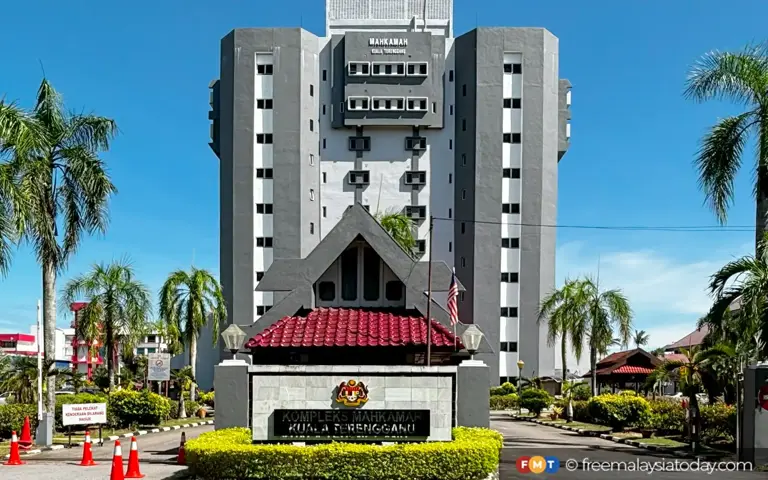 Woman charged with misusing company funds to pay husband